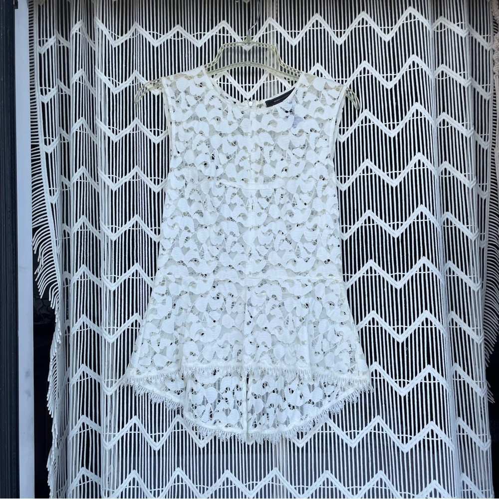 BCBGMAXAZRIA lace peplum zip back top
